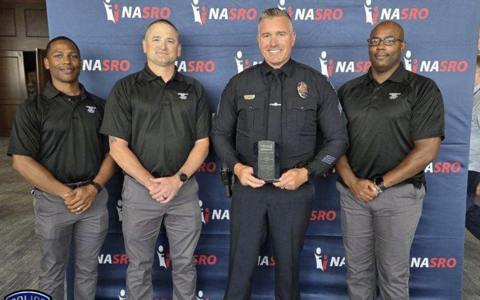 Meridian Police Officer standing next to fellow School Resource Officers from the National Association of School Resource Officers after receiving Model Agency Award.